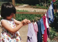 Child hanging laundry