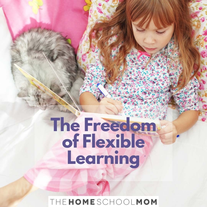 child lying on a bed coloring in a book next to a cat with text The Freedom of Flexible Learning - TheHOmeSchoolMom