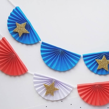 Paper craft red, white, and blue garland.