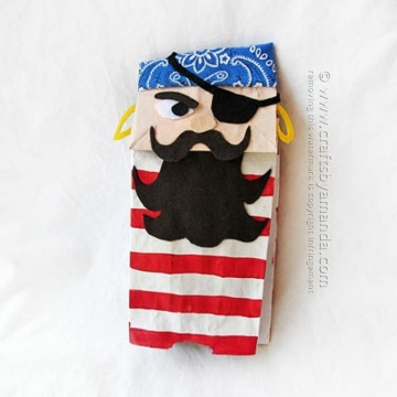 DIY pirate puppet made from paper bag and fabric.