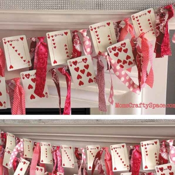 heart playing card garland with fabric strips.