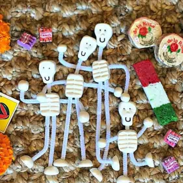 Home made clay calacas with pipe cleaner bodies.